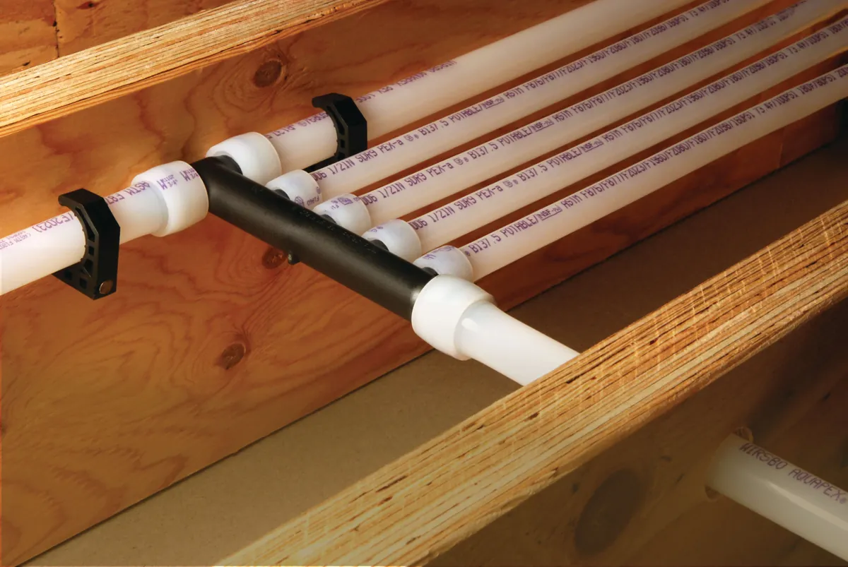PEX-A multiport tee distributing water lines along joists – Planning a Rinnai Tankless Water Heater Installation for Your San Clemente Home for San Clemente, CA homes